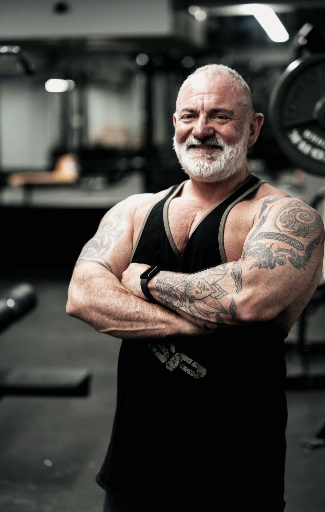 Tony Barnbrook, IFBB Pro, arms crossed in the gym